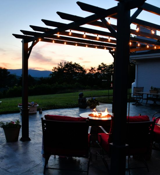 comfortable outside seating area with fire pit table and pergola with lights in evening or morning qy4on0mfm8f88pqnpo3bu6fmb01ug0vlv1bteejshc